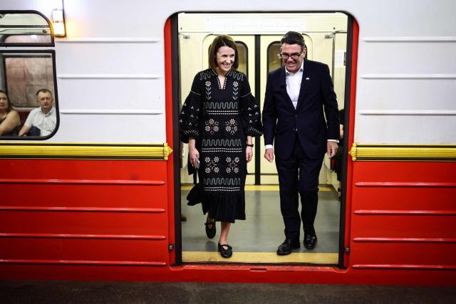 Britain's Prime Minister Andy Burnham (R) gets out of a metro carriage upon arrival at the metro station Lukanivska, in Kyiv, on August 24, 2026, during his first trip abroad since taking office. The United Kingdom will keep providing defence aid to Ukraine despite Russia's threats, Prime Minister Andy Burnham said on August 24, 2026 on a visit to Kyiv where allies gathered to discuss support. Air defence supplies are due to be the main priority at the meeting of the Coalition of the Willing, jointly chaired by the leaders of France and Germany, who will participate remotely, and by Britain's Burnham. (Photo by Henry NICHOLLS / POOL / AFP)
