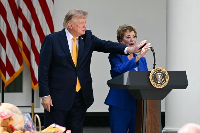 US Secretary of Education Linda McMahon speaks as US President Donald Trump adjusts the microphone in the Rose Garden of the White House in Washington, DC, on August 24, 2026. (Photo by Jim WATSON / AFP)