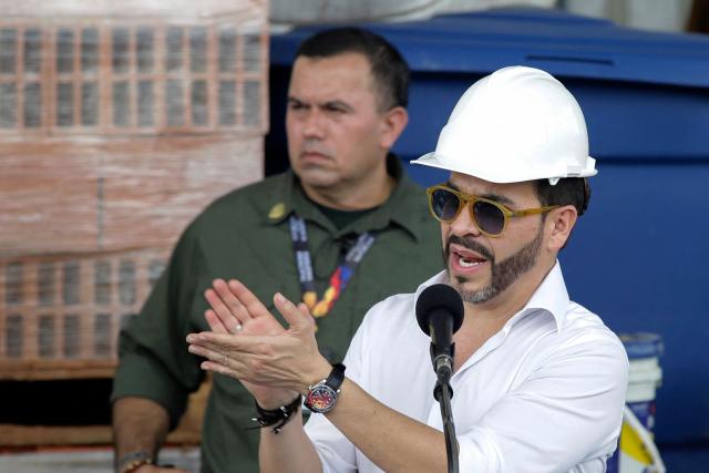Colombia's President Abelardo de la Espriella delivers a speech at a logistics center in Buenaventura, Valle del Cauca Department, Colombia, on August 24, 2026, two weeks after a 7.4-magnitude earthquake struck the region. (Photo by Cesar QUEIROZ / AFP)