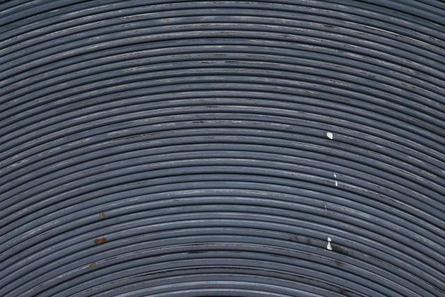 Coils of steel are seen at an ArcelorMittal Dofasco facility in Hamilton, Ontario, Canada, on August 24, 2026. The administration of US President Donald Trump warned on August 23 that Canada would be "foolish" to think it could win a trade war with the United States, predicting a "devastating" impact on its northern neighbor. Negotiations between Washington and Ottawa broke down late August 22, putting into force new 50-percent US tariffs impacting about $20 billion worth of Canadian goods, or 5.5 percent of Canadian exports to the US. Canada in retaliation said it would match US tariffs, with new levies notably targeting the US steel and dairy industries to take effect on September 8. (Photo by Cole Burston / AFP)