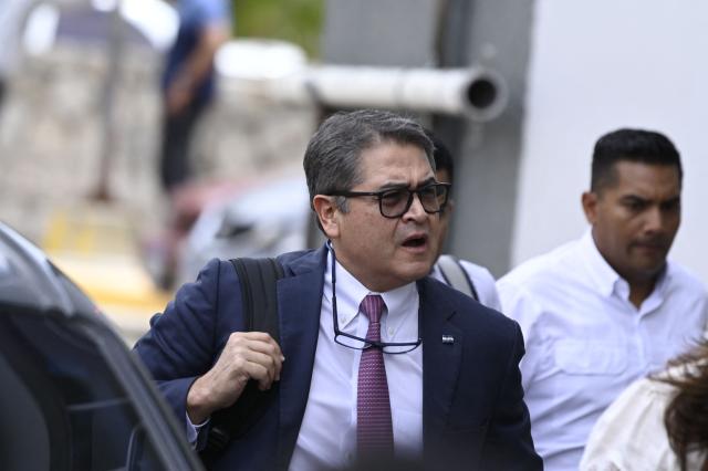 Honduras' former president (2016–2022), Juan Orlando Hernandez, arrives for a hearing in his trial on alleged corruption charges at the Supreme Court of Justice in Tegucigalpa on August 24, 2026. (Photo by Orlando SIERRA / AFP)