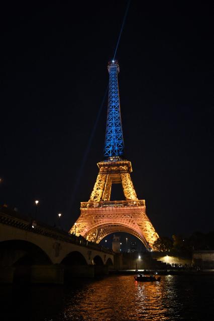 This photograph shows the Eiffel Tower illuminated in the colours of the Ukrainian flag to commemorate the 35th anniversary of Ukrainian independence, in Paris, on August 24, 2026. (Photo by Christophe DELATTRE / AFP)