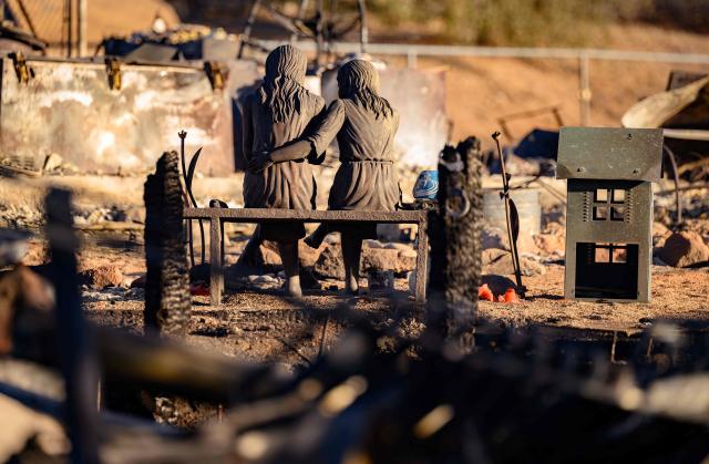 A statue is left amid the remains of a home burned by the Hawk Fire in Reno, Nevada on August 24, 2026. Tens of thousands of people looked set to spend another night away from home on August 24 as a wind-driven fire bore down on the western US city of Reno. Schools were shuttered as smoke swathed the city in Nevada, near the California border, home to around 280,000 people.
Around 24,000 were still under evacuation orders on Monday, officials said, down from over 40,000 at its peak. (Photo by Josh Edelson / AFP)