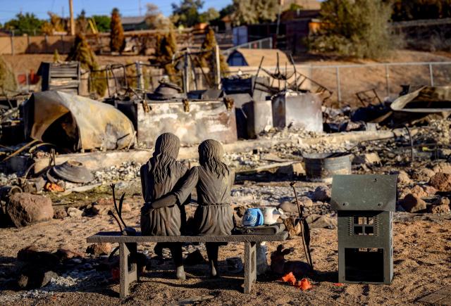 A statue is left amid the remains of a home burned by the Hawk Fire in Reno, Nevada on August 24, 2026. Tens of thousands of people looked set to spend another night away from home on August 24 as a wind-driven fire bore down on the western US city of Reno. Schools were shuttered as smoke swathed the city in Nevada, near the California border, home to around 280,000 people.
Around 24,000 were still under evacuation orders on Monday, officials said, down from over 40,000 at its peak. (Photo by Josh Edelson / AFP)