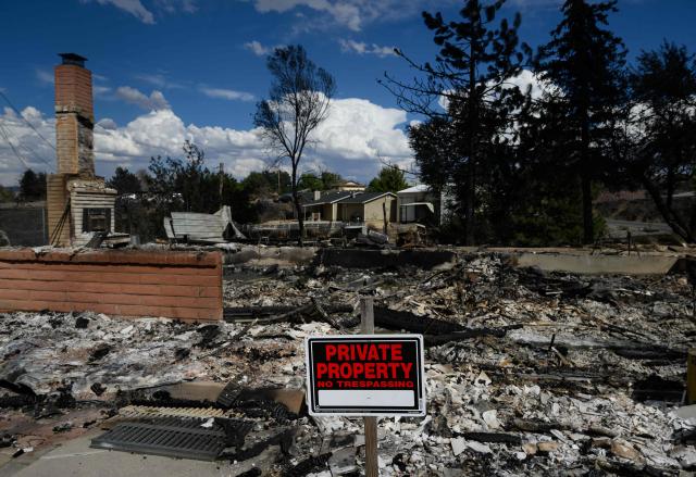 A burned home smolders after it was destroyed by the Hawk fire in Reno, Nevada on August 24, 2026. Tens of thousands of people looked set to spend another night away from home on August 24 as a wind-driven fire bore down on the western US city of Reno. Schools were shuttered as smoke swathed the city in Nevada, near the California border, home to around 280,000 people.
Around 24,000 were still under evacuation orders on Monday, officials said, down from over 40,000 at its peak. (Photo by Josh Edelson / AFP)