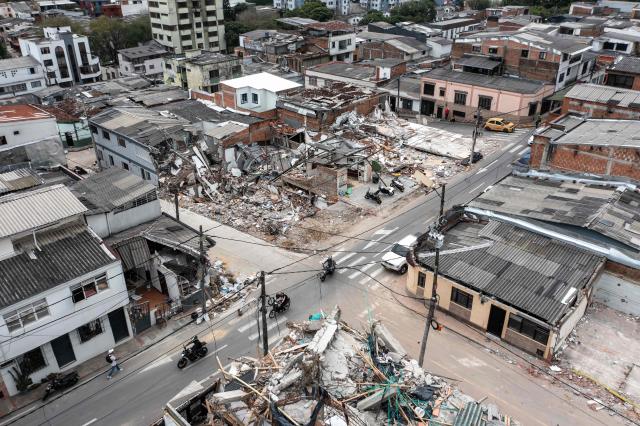 This aerial view shows the rubble and debris of collapsed buildings 14 days after the 7.4-magnitude earthquake in Pereira, Colombia on August 24, 2026. The powerful earthquake that killed hundreds of people in western Colombia on August 10, 2026, caused $9.57 billion in economic losses, President Abelardo de la Espriella said on August 18, issuing a preliminary estimate. The death toll stands at 289, with a further 4,187 injured and 143 missing. (Photo by ESTEBAN VEGA LA-ROTTA / AFP)