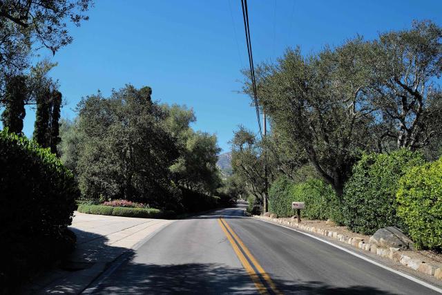 The road outside the home owned by Britain's Prince Harry, Duke of Sussex, and his wife Meghan, Duchess of Sussex, is pictured in the Riven Rock neighborhood of Montecito, near Santa Barbara, California on August 24, 2026. Prince Harry and his wife Meghan, who cut ties with the British royal family in 2020, are moving back to the United Kingdom, British press reported on August 19, 2026. After stepping back as working royals in 2020, Harry, 41, and Meghan, 45, eventually settled in Montecito, California. (Photo by LISA O'CONNOR / AFP)