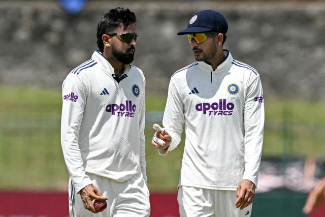 India's captain Shubman Gill (R) speaks with teammate Saransh Jain during the third day of the second Test cricket match between Sri Lanka and India at the Sinhalese Sports Club Ground in Colombo on August 25, 2026. (Photo by Ishara S. KODIKARA / AFP)