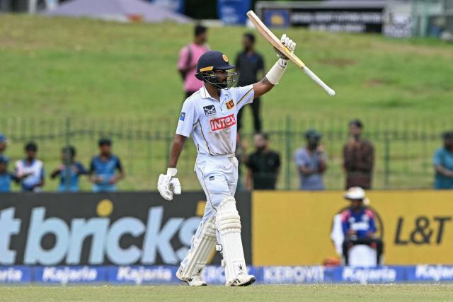 Sri Lanka's Pasindu Sooriyabandara celebrates after scoring a half-century (50 runs) during the third day of the second Test cricket match between Sri Lanka and India at the Sinhalese Sports Club Ground in Colombo on August 25, 2026. (Photo by Ishara S. KODIKARA / AFP)