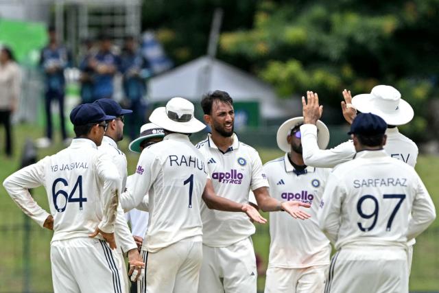 India's Prasidh Krishna (C) celebrates with teammates after taking the wicket of Sri Lanka's Kamindu Mendis during the third day of the second Test cricket match between Sri Lanka and India at the Sinhalese Sports Club Ground in Colombo on August 25, 2026. (Photo by Ishara S. KODIKARA / AFP)