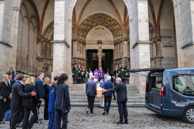 The coffin of French senator Francois Patriat is carried into former collegiate church of Notre-Dame or his funeral ceremony in Semur-en-Auxois on August 25, 2026. Senator from the Côte-d'Or, former president of the Burgundy Region, former minister and president of the "Rassemblement des democrates, progressistes et independants" group in the Senate Francois Patriat died at a hospital in Dijon as a result of a serious bicycle accident that occurred on July 17. (Photo by OLIVIER CHASSIGNOLE / AFP)