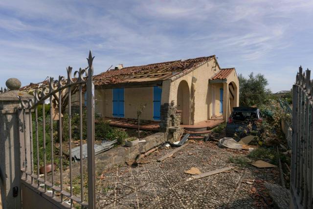 This photograph shows a damaged house following a tornado in Pomas, southwestern France on August 25, 2026. A tornado struck the Aude department on August 24, 2026. In the aftermath of a violent tornado, the village of Pomas (Aude) was taking stock of the damage on August 25, 2026: there were 39 people injured, two of whom were in a critical condition, and 300 homes affected, according to the prefecture. (Photo by Idriss Bigou-Gilles / AFP)