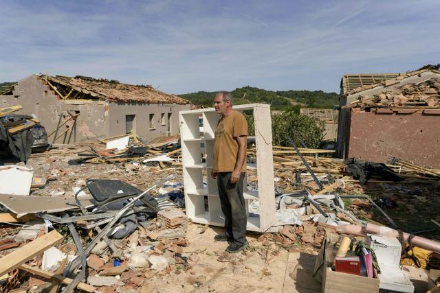 A man stands amongst the rubble of a damaged house following a tornado in Pomas, southwestern France on August 25, 2026. A tornado struck the Aude department on August 24, 2026. In the aftermath of a violent tornado, the village of Pomas (Aude) was taking stock of the damage on August 25, 2026: there were 39 people injured, two of whom were in a critical condition, and 300 homes affected, according to the prefecture. (Photo by Idriss Bigou-Gilles / AFP)