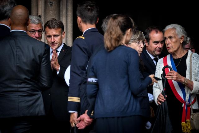 France's President Emmanuel Macron (2nd L) and France's Prime Minister Sebastien Lecornu (2nd R) leave the funeral ceremony of French Senator Francois Patriat, president of the Rassemblement des Democrates, Progressistes et Independants - RDPI (Rally of Democrats, Progressives and Independents) group in the Senate, at the Collegiate Church of Semur-en-Auxois, central France on August 25, 2026. (Photo by OLIVIER CHASSIGNOLE / AFP)