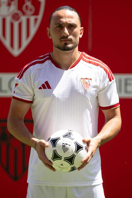 Sevilla FC's new player Georgian midfielder Giorgi Kochorashvili poses during his official presentation at the Ramon Sanchez Pizjuam stadium in Seville on August 25, 2026. (Photo by JORGE GUERRERO / AFP)