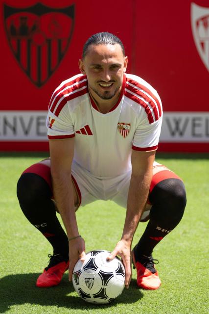 Sevilla FC's new player Georgian midfielder Giorgi Kochorashvili poses during his official presentation at the Ramon Sanchez Pizjuam stadium in Seville on August 25, 2026. (Photo by JORGE GUERRERO / AFP)