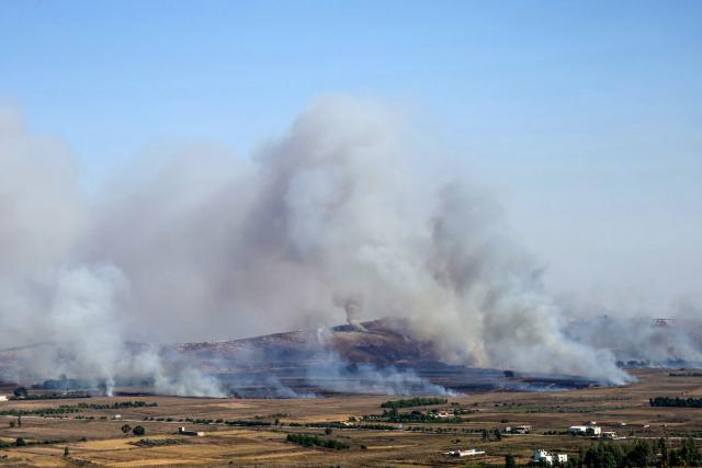 Smoke rises from fires ignited by Israeli shelling that targeted the plain of Marjayoun in southern Lebanon on August 25, 2026. Lebanon was drawn into the Middle East war on March 2, when pro-Iran Hezbollah launched rockets towards Israel in response to US-Israeli strikes that killed Iranian supreme leader on February 28, 2026. Despite a November 2024 ceasefire that was supposed to end more than a year of hostilities between Israel and the Iran-backed Hezbollah group, Israel has kept up strikes on Lebanon and has maintained troops in areas in southern Lebanon it deems strategic. (Photo by AFP) / 