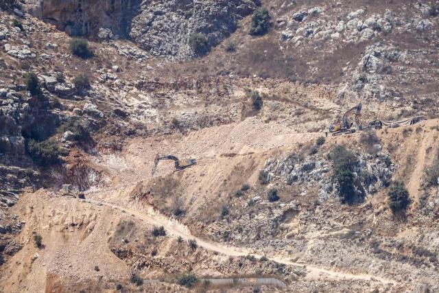 This photograph taken from the southern Lebanese area of Marjayoun shows Israeli bulldozers opening routes in the mountainous area of al Shqif and along the Litani river on August 25, 2026. Lebanon was drawn into the Middle East war on March 2, when pro-Iran Hezbollah launched rockets towards Israel in response to US-Israeli strikes that killed Iranian supreme leader on February 28, 2026. Despite a November 2024 ceasefire that was supposed to end more than a year of hostilities between Israel and the Iran-backed Hezbollah group, Israel has kept up strikes on Lebanon and has maintained troops in areas in southern Lebanon it deems strategic. (Photo by AFP) / 