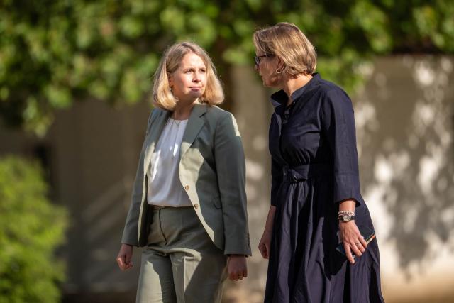 German Minister for Housing, Urban Development and Building Verena Hubertz (L) and German Minister for Justice and Consumer Protection Stefanie Hubig arrive for the second day of a two day retreat meeting of the German cabinet on August 26, 2026 in Neuhardenberg, northeastern Germany. (Photo by Michael Kappeler / POOL / AFP)