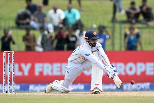 Sri Lanka's captain Dhananjaya de Silva plays a shot during the fourth day of the second Test cricket match between Sri Lanka and India at the Sinhalese Sports Club Ground in Colombo on August 26, 2026. (Photo by Ishara S. KODIKARA / AFP)
