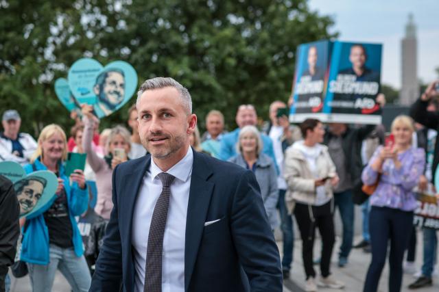 Far-right Alternative for Germany (AfD) party's main candidate Ulrich Siegmund arrives for a debate on MDR regional TV in Magdeburg, eastern Germany on August 26, 2026. Saxony-Anhalt will go to the polls in the regional elections on September 6, 2026. (Photo by Ronny HARTMANN / AFP)