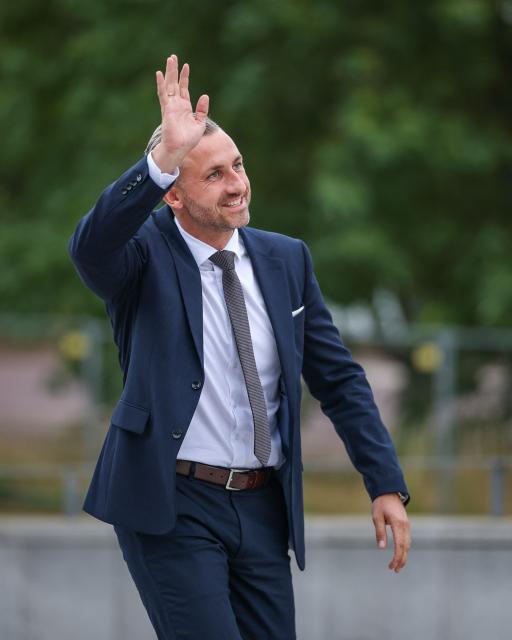 Far-right Alternative for Germany (AfD) party's main candidate Ulrich Siegmund waves to supporters as he arrives for a debate on MDR regional TV in Magdeburg, eastern Germany on August 26, 2026. Saxony-Anhalt will go to the polls in the regional elections on September 6, 2026. (Photo by Ronny HARTMANN / AFP)
