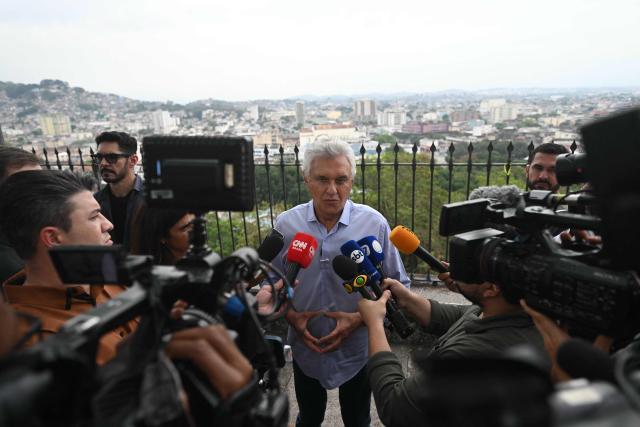 Brazilian presidential candidate Ronaldo Caiado of the Social Democratic Party (PSD) speaks to members of the press during a visit to the Nossa Senhora da Penha Church in the northern zone of Rio de Janeiro, Brazil, on August 26, 2026. (Photo by MAURO PIMENTEL / AFP)