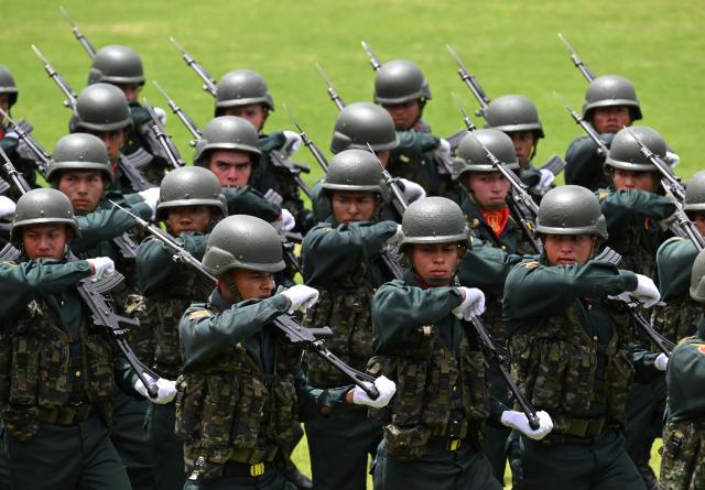 Army cadets march as Colombia's President Abelardo de la Espriella leads the change of command ceremony at the Jose Maria Cordova Military School in Bogota on August 26, 2026. Colombia's new hard-right government announced on August 25, 2026, plans to classify guerrilla fighters, drug traffickers and other criminal groups as "terrorists." (Photo by Raul ARBOLEDA / AFP)
