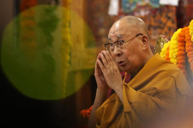 (FILES) Tibetan spiritual leader Dalai Lama attends a Long Life Prayer offering ceremony at the Main Tibetan Temple in McLeod Ganj, near Dharamsala on September 10, 2025. Buddhist spiritual leader the Dalai Lama said on August 27 that he was praying for all those killed in devastating floods in Nepal and Tibet. (Photo by Sanjay BAID / AFP)