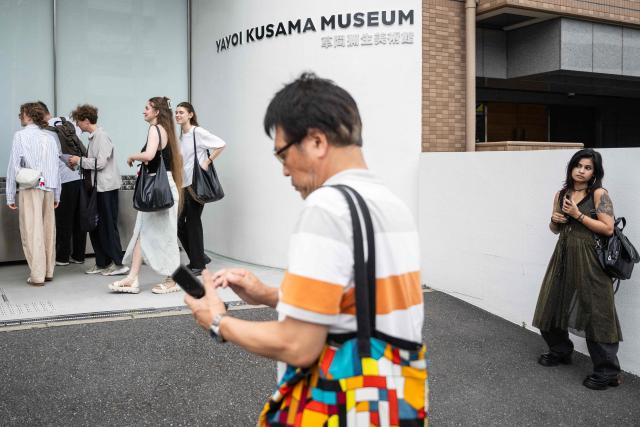 Visitors line up outside the Yayoi Kusama Museum in Tokyo on August 27, 2026. Japan's Yayoi Kusama, one of the world's most celebrated contemporary artists, has died aged 97, her company said on August 27, triggering tributes from around the world. (Photo by Andrew CABALLERO-REYNOLDS / AFP)