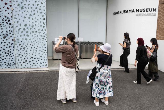 Visitors line up outside the Yayoi Kusama Museum in Tokyo on August 27, 2026. Japan's Yayoi Kusama, one of the world's most celebrated contemporary artists, has died aged 97, her company said on August 27, triggering tributes from around the world. (Photo by Andrew CABALLERO-REYNOLDS / AFP)