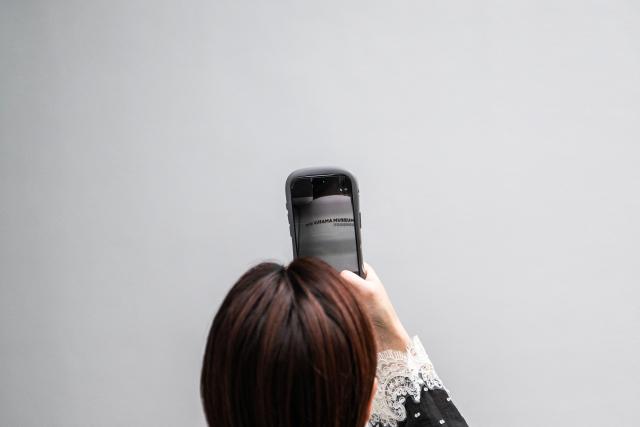 A woman takes a photo outside the Yayoi Kusama Museum in Tokyo on August 27, 2026. Japan's Yayoi Kusama, one of the world's most celebrated contemporary artists, has died aged 97, her company said on August 27, triggering tributes from around the world. (Photo by Andrew CABALLERO-REYNOLDS / AFP)