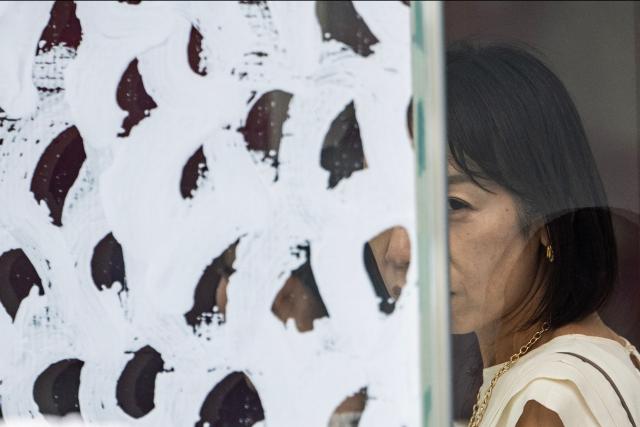 A woman visits the Yayoi Kusama Museum in Tokyo on August 27, 2026. Japan's Yayoi Kusama, one of the world's most celebrated contemporary artists, has died aged 97, her company said on August 27, triggering tributes from around the world. (Photo by Andrew CABALLERO-REYNOLDS / AFP)