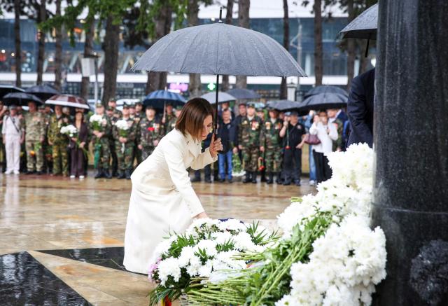 Moldovan President Maia Sandu lays flowers at the “Maica Indurerata” (Grieving Mother) monument which honors those who died defending Moldova’s independence and territorial integrity, including in the 1992 Transnistria conflict, during a ceremony marking Moldova’s National Day, at the Eternitate Memorial Complex in Chisinau, on August 27, 2026. Moldova marks National Day on August 27, commemorating its 1991 Declaration of Independence from the Soviet Union. (Photo by Elena COVALENCO / AFP)