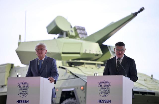 Hesse's State Premier Boris Rhein (R) and the CEO of German arms manufacturer Rheinmetall Armin Papperger give a statement to present the "Memorandum of Understanding (MoU)", on August 27, 2026 at the airport of Kassel, western Germany. The state of Hesse and Rheinmetall aim to develop northern Hesse as a hub for innovation and defense and economic strength. (Photo by Sascha Schuermann / AFP)
