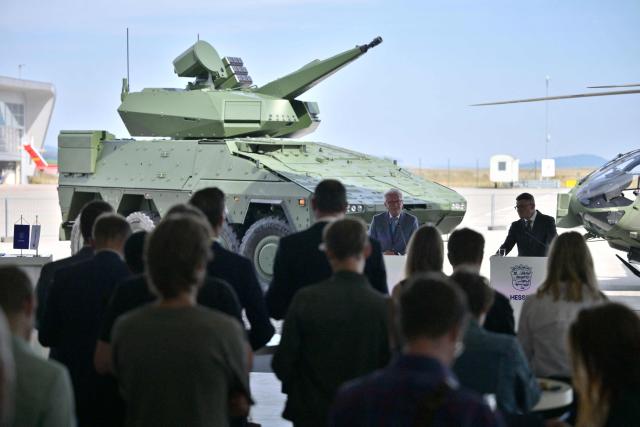 Hesse's State Premier Boris Rhein (R) and the CEO of German arms manufacturer Rheinmetall Armin Papperger give a statement to present the "Memorandum of Understanding (MoU)", on August 27, 2026 at the airport of Kassel, western Germany. The state of Hesse and Rheinmetall aim to develop northern Hesse as a hub for innovation and defense and economic strength. (Photo by Sascha Schuermann / AFP)
