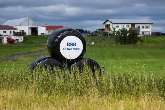 A “Nei takk” (No thanks) sign opposing the ESB (EU in Icelandic) is displayed on wrapped hay bales outside a farm near Reykjavнk, Iceland, on August 26, 2026, ahead of a local referendum. Icelanders are to vote August 29, 2026 on whether to resume entry talks with the European Union 13 years after they were suspended, in a referendum seen going down to the wire. (Photo by Jonathan NACKSTRAND / AFP)