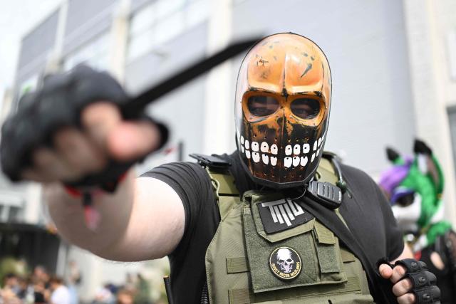 A cosplayer is pictured at the Gamescom video games trade fair on the fair grounds in Cologne, western Germany, on August 27, 2026. The 2026 edition of the vast Gamescom trade fair in Cologne, Germany, had its opening night on August 25, 2025 and will be running from August 26 to 30, 2026. (Photo by Ina FASSBENDER / AFP)