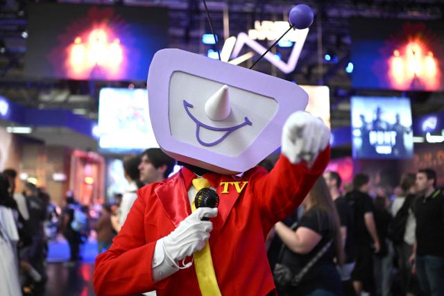 A cosplayer is pictured at the Gamescom video games trade fair on the fair grounds in Cologne, western Germany, on August 27, 2026. The 2026 edition of the vast Gamescom trade fair in Cologne, Germany, had its opening night on August 25, 2025 and will be running from August 26 to 30, 2026. (Photo by Ina FASSBENDER / AFP)