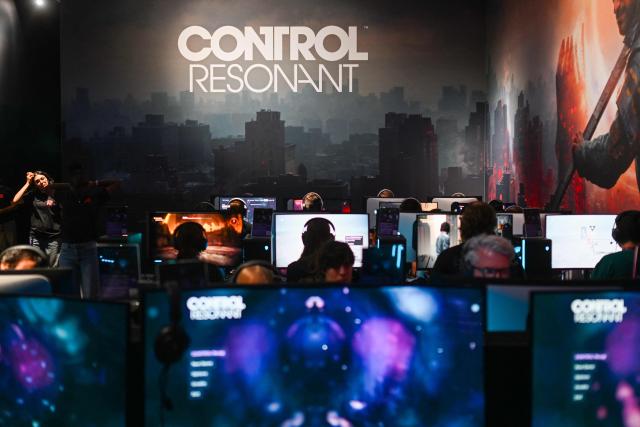 Gamers play the "Control Resonant" video game of Remedy Entertainment during the Gamescom video games trade fair on the fair grounds in Cologne, western Germany, on August 27, 2026. The 2026 edition of the vast Gamescom trade fair in Cologne, Germany, had its opening night on August 25, 2025 and will be running from August 26 to 30, 2026. (Photo by Ina FASSBENDER / AFP)