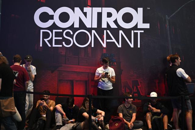 Gamers wait to play the "Control Resonant" video game of Remedy Entertainment during the Gamescom video games trade fair on the fair grounds in Cologne, western Germany, on August 27, 2026. The 2026 edition of the vast Gamescom trade fair in Cologne, Germany, had its opening night on August 25, 2025 and will be running from August 26 to 30, 2026. (Photo by Ina FASSBENDER / AFP)