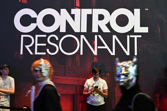 Gamers wait to play the "Control Resonant" video game of Remedy Entertainment during the Gamescom video games trade fair on the fair grounds in Cologne, western Germany, on August 27, 2026. The 2026 edition of the vast Gamescom trade fair in Cologne, Germany, had its opening night on August 25, 2025 and will be running from August 26 to 30, 2026. (Photo by Ina FASSBENDER / AFP)