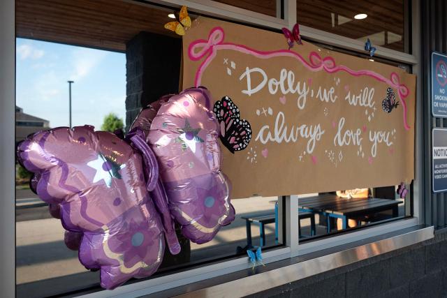 This photo taken on August 26, 2026, shows a message of support for Dolly Parton on the window of Dutch Bros Coffee Shop in Parton's hometown of Sevierville, Tennessee. Parton, the country music star who rose from grinding poverty in Tennessee to become a rhinestone-studded cultural icon with hits like "Jolene" and "9 to 5," has died at 80, her family said on August 25, 2026. Parton was more than a singer -- she wrote 3,000 songs, acted in major Hollywood films and donated millions of dollars to charities in her home state and beyond. (Photo by A.M. Stewart / AFP)