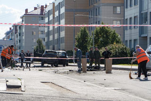 Investigators work at the scene of a car explosion in Saint Petersburg on August 27, 2026. A car explosion killed one person in Saint Petersburg on August 27, 2026, Russian investigators said, with Russian media reporting it was an army officer in what appeared to be the latest assassination during the Ukraine war. (Photo by AFP)