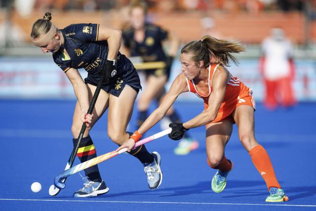 Belgium's Charlotte Englebert (L) and Netherlands' Xan de Waard fight for the ball during the 2026 FIH Women's Hockey World Cup semifinal between the Netherlands and Belgium at the Wagener Stadium in Amstelveen, western Netherlands, on August 27, 2026. (Photo by Koen Van WEEL / ANP / AFP) / Netherlands OUT