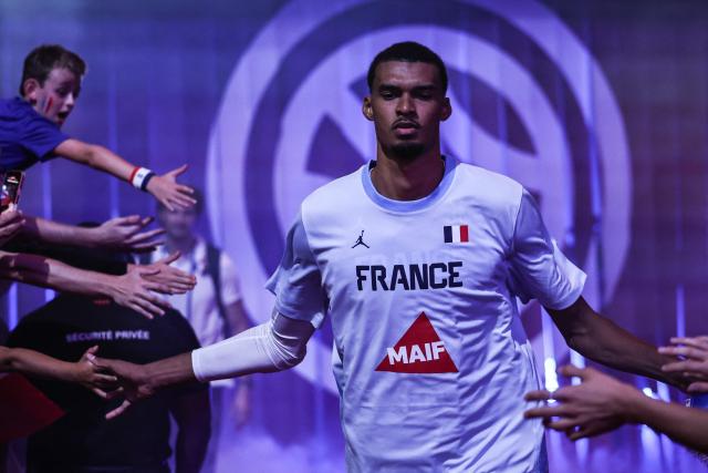 France's #32 Victor Wembanyama enters the court before the FIBA Basketball World Cup 2027 European Qualifier game between France and Slovenia at the Palais Omnisports de Paris-Bercy, in Paris on August 27, 2026. (Photo by SIMON WOHLFAHRT / AFP)