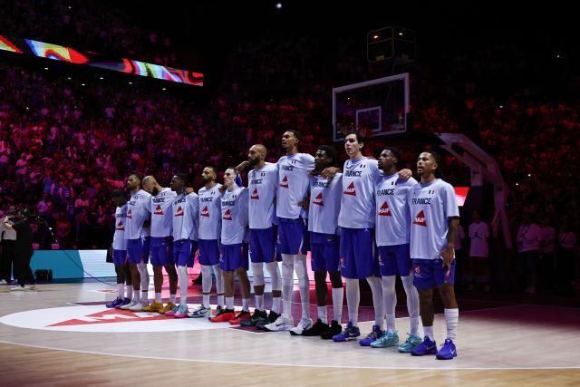 France's basketball players sing the French national anthem "La Marseillaise" before the FIBA Basketball World Cup 2027 European Qualifier game between France and Slovenia at the Palais Omnisports de Paris-Bercy, in Paris on August 27, 2026. (Photo by SIMON WOHLFAHRT / AFP)