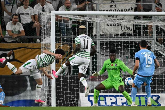 Ferencvaros' Irish midfielder #47 Callum O'Dowda (L) scores the opening goal during the UEFA Europa League second leg playoff football match between   Ferencvaros and Trabzonspor in Budapest on August 27, 2026. (Photo by Attila KISBENEDEK / AFP)