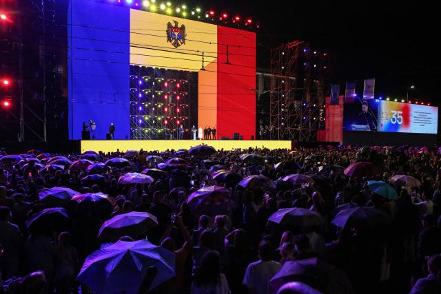 Ukrainian President Volodymyr Zelenskyy (C) speaks next to Moldovan President Maia Sandu (R) and Romanian President Nicusor Dan (L) during an official ceremony on the occasion of Moldova’s National Day in Chisinau on August 27, 2026. Moldova celebrates its National Day on August 27, commemorating the adoption of the Declaration of Independence from the Soviet Union in 1991. Zelenskyy joined Moldovan leaders and foreign dignitaries for events dedicated to the anniversary of independence. (Photo by Elena COVALENCO / AFP)
