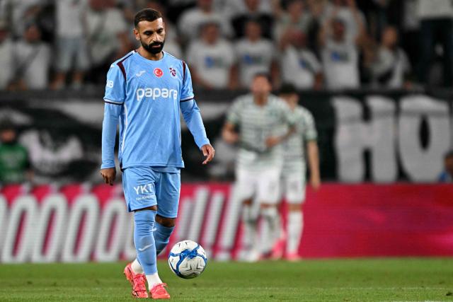Trabzonspor's Egyptian forward #10 Mohamed Salah reacts after Ferencvaros' opening goal during the UEFA Europa League second leg playoff football match between   Ferencvaros and Trabzonspor in Budapest on August 27, 2026. (Photo by Attila KISBENEDEK / AFP)